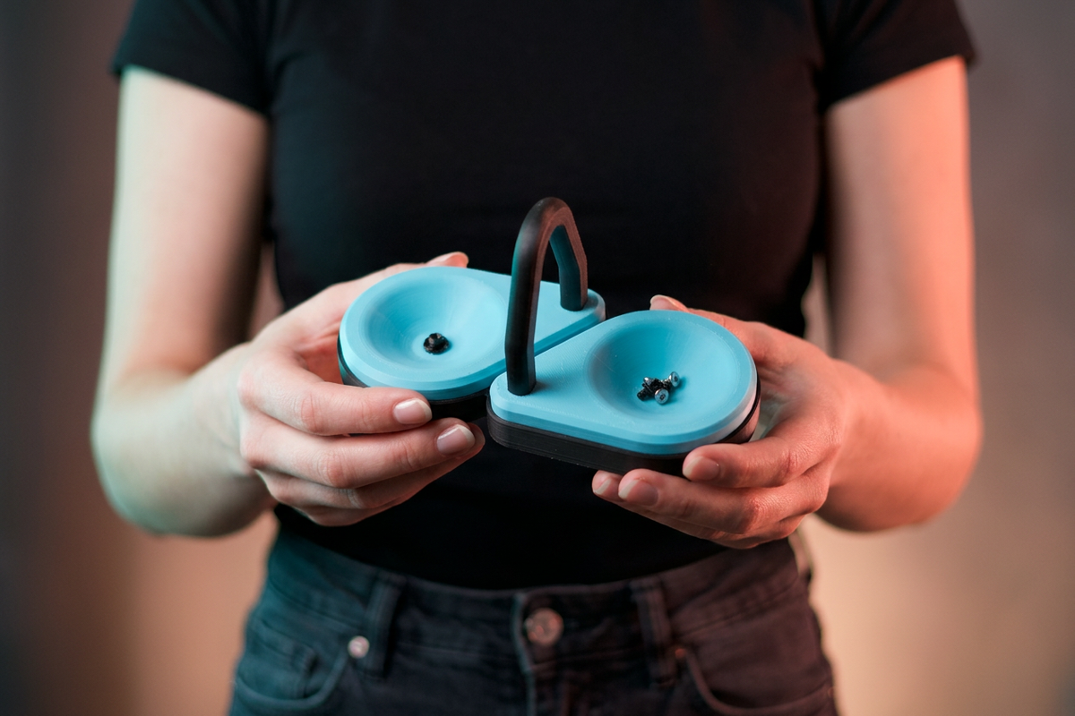 Teardrop Project Trays blue black held in hands person wearing black top warm lifestyle photo