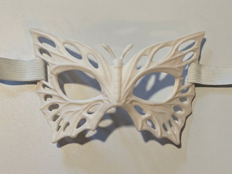 White Butterfly Mask product photo showing the sculpted wings and open eyeholes; strap not included.