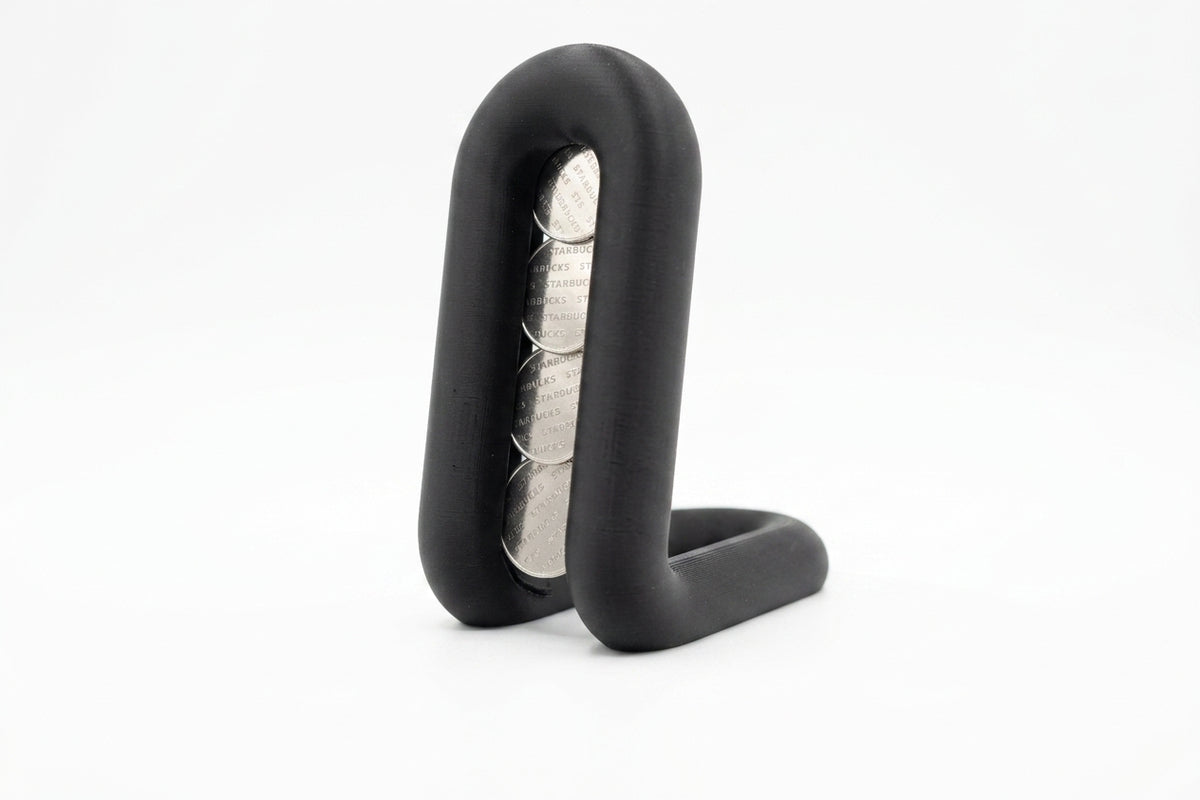 Wibble coffee pod holder render front view showing full arch loop and oval channel