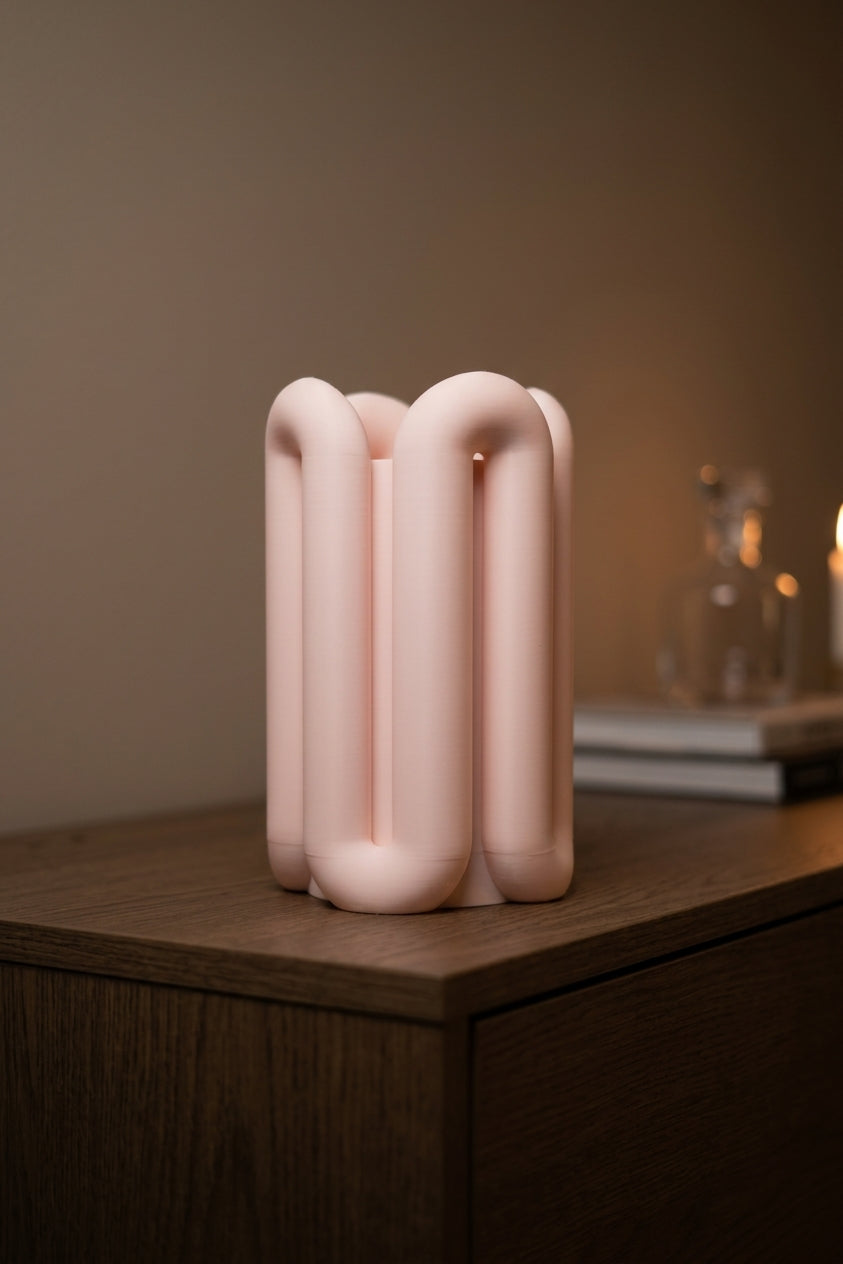 Eleva Wibble Aesthetic Vase blush pink on dark slate plinth with gold vase and monstera leaves moody dark luxury lifestyle